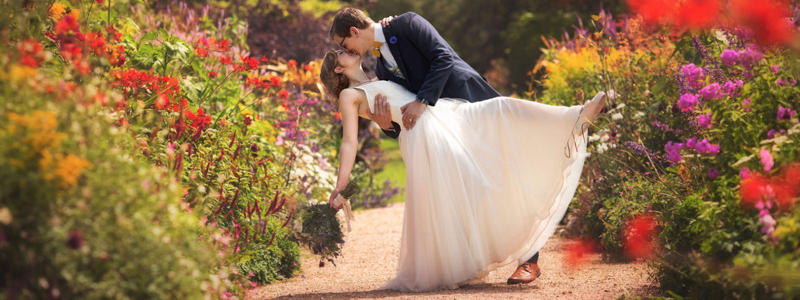blush tulle bespoke wedding dress Felicity westmacott with bright flowers
