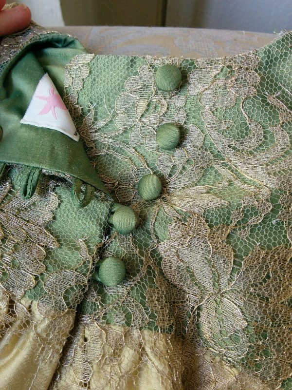 Mini-me Christening gown in green silk and gold lace by Felicity Westmacott: button and loop back detail