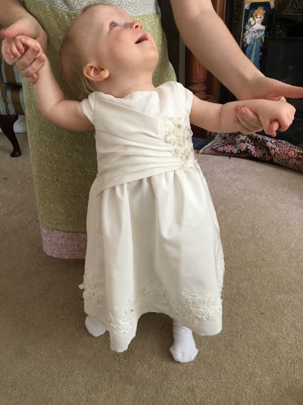 Mini-me christening dress by Felicity Westmacott, made from mummy's wedding dress in ivory taffeta and beaded applique