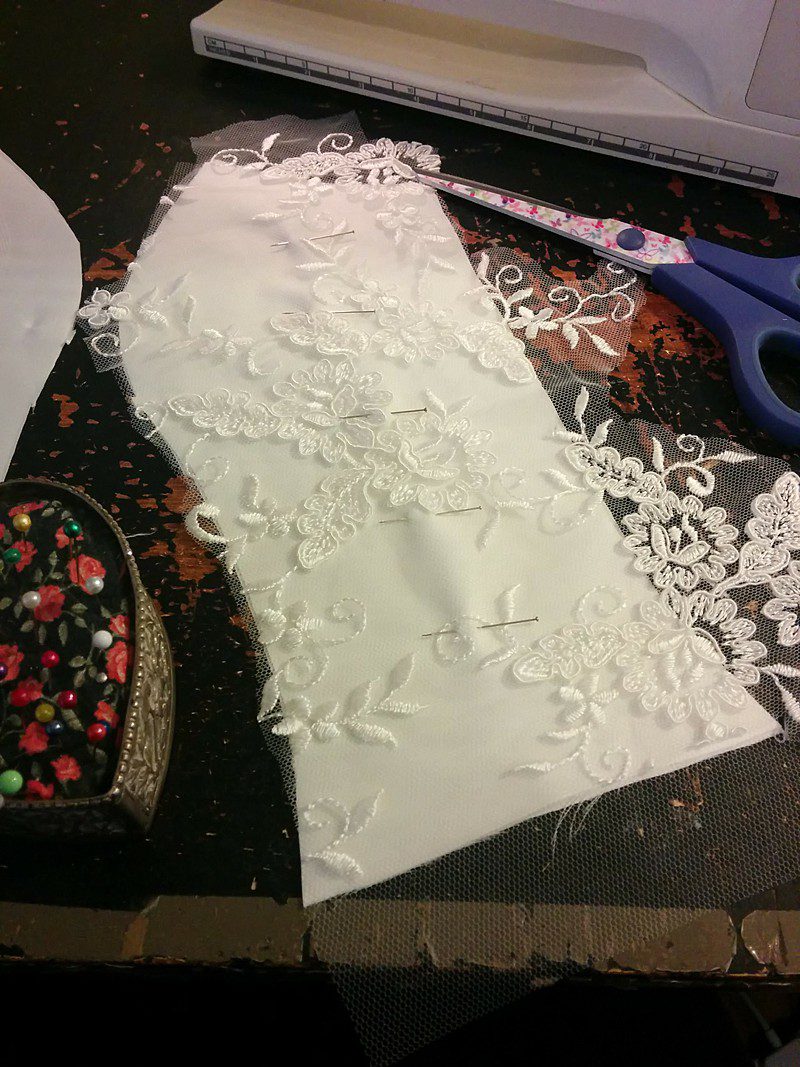 creating a corded lace bodice panel in the studio of a bespoke dressmaker