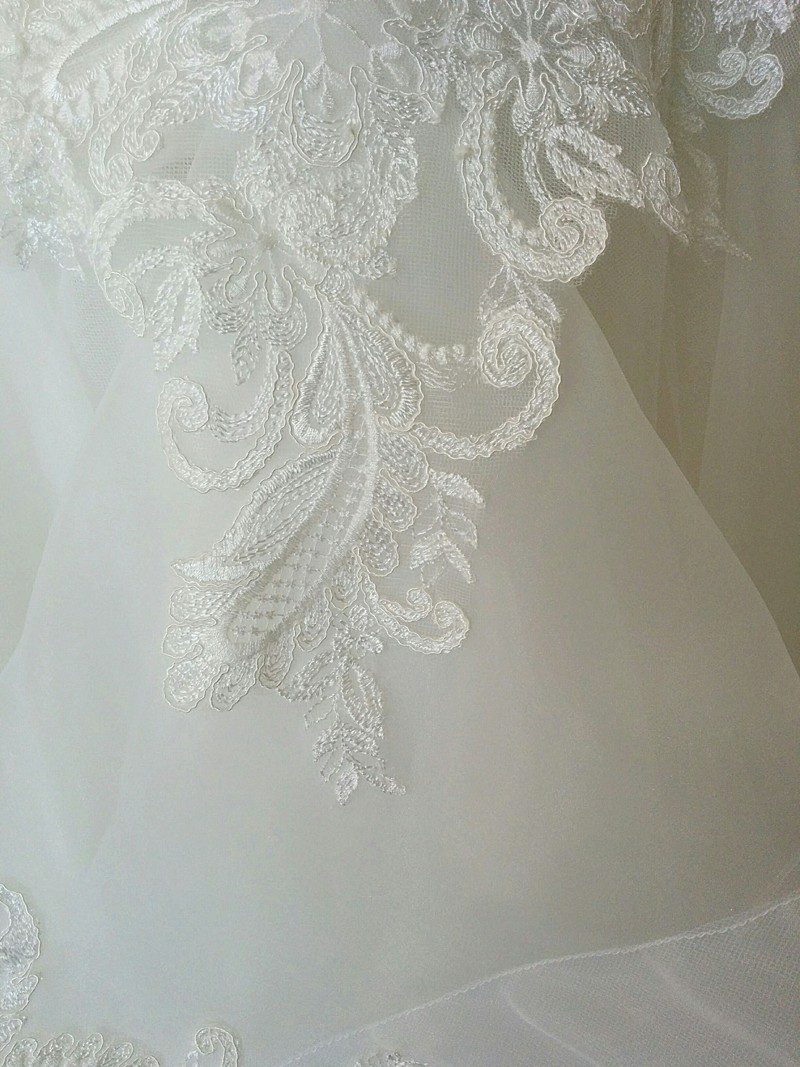 ivory corded lace motif applique detail on bespoke wedding dress