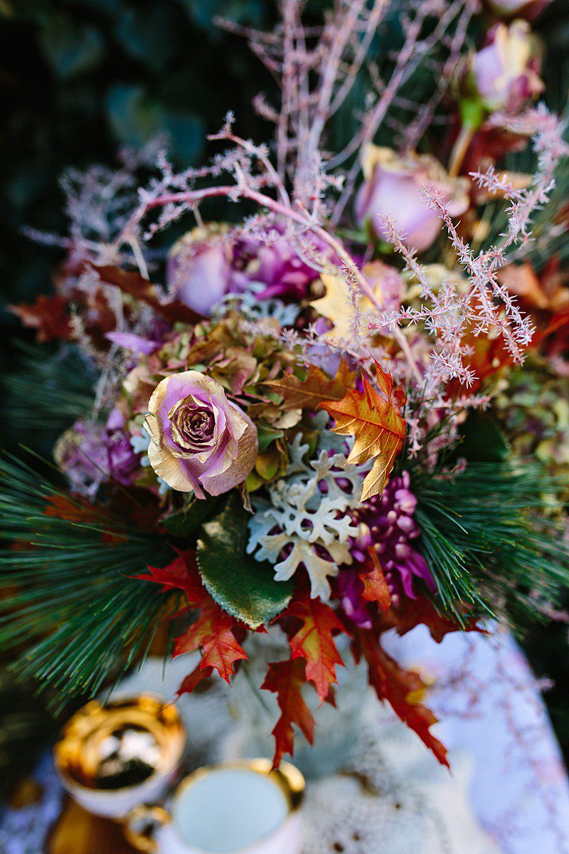 bridal bouquet rosegold and orange vase arrangement