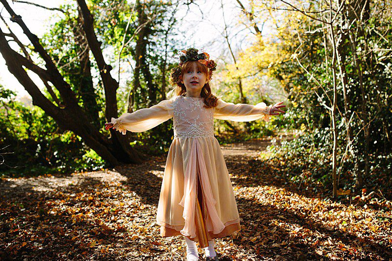 flowergirl november wedding in rosegold layers and hair wreath