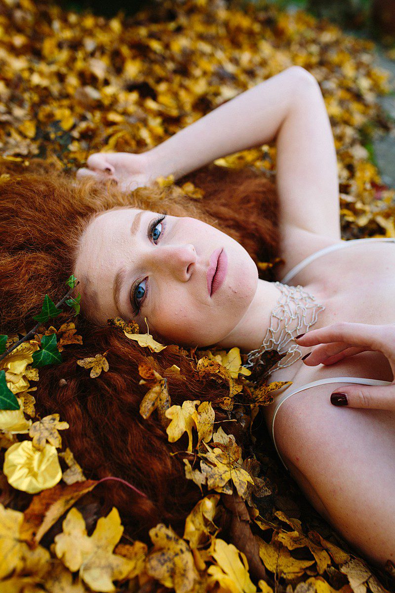 styled shoot with gold leaves red hair bridal inspiration