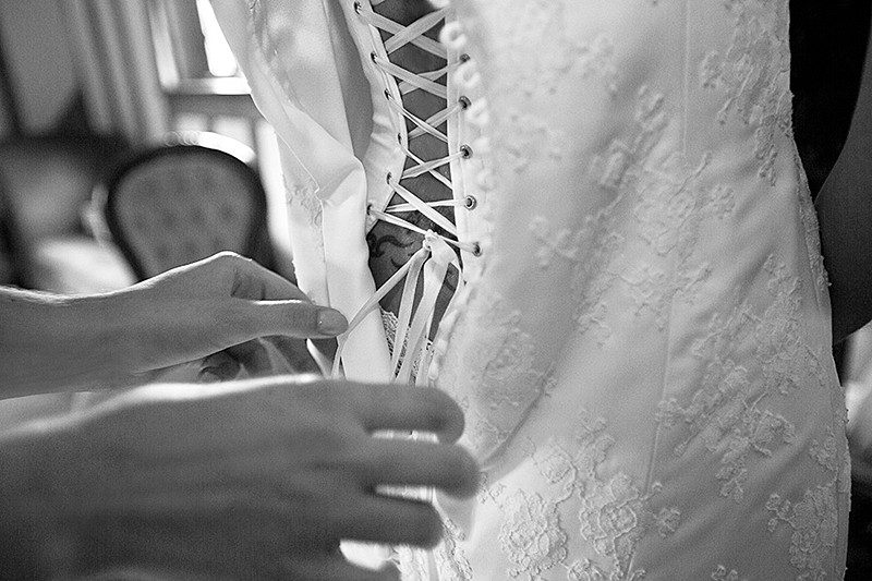 lace up back hidden corset in boned button back wedding dress