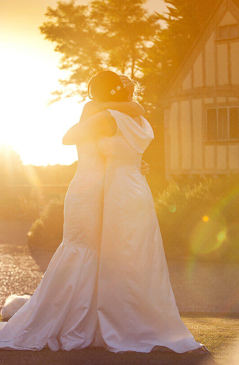 bride and sister in the sun bridesmaid maid matron of honour cowl back
