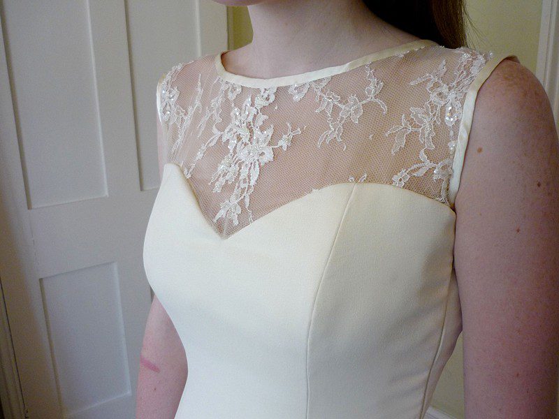 charlie 27 neckline detail on sweetheart and high lace sleeveless wedding dress