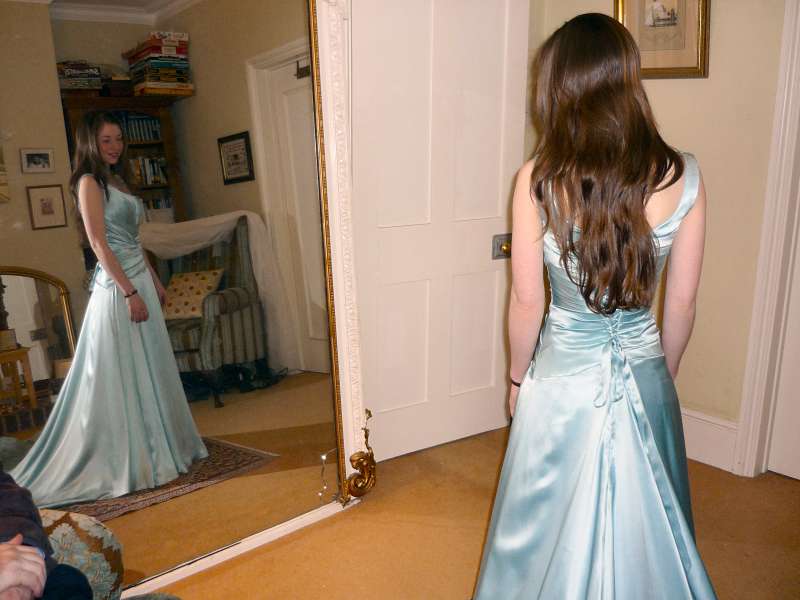 finished dress in the mirror fitting room