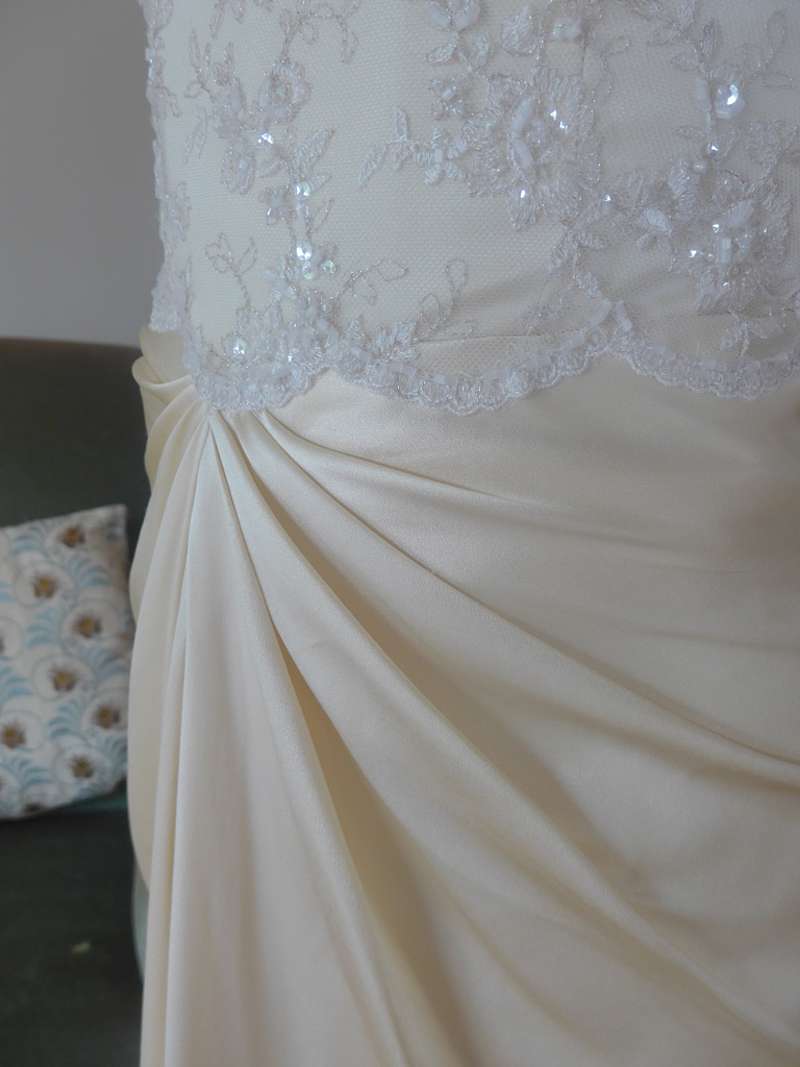 bridal detail of draped wedding skirt silk crepe satin