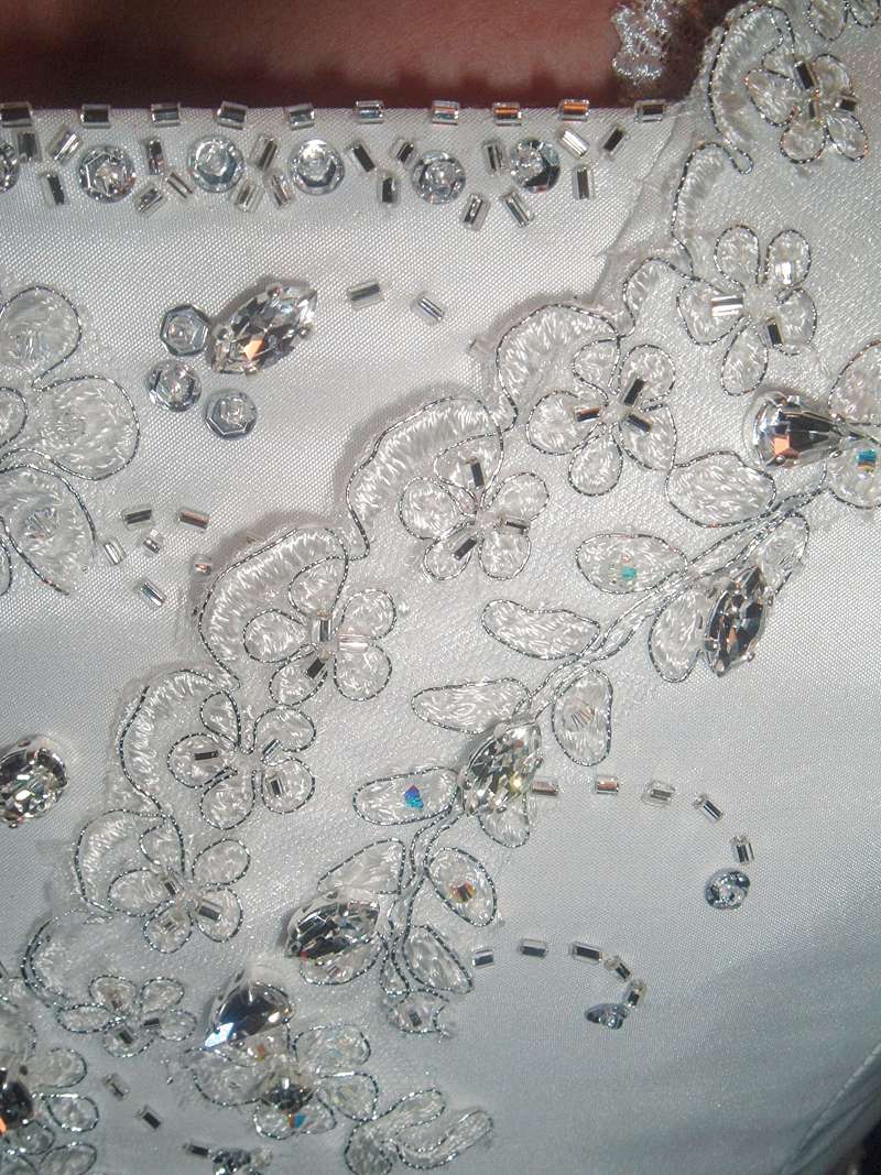 hand applique and beading to wedding dress
