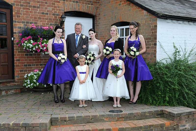  before the ceremony bride and purple bridesmaids