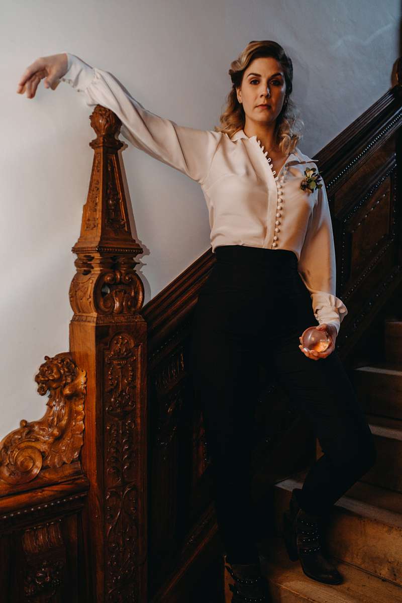 jareth on the stairs blouse shirt and trousers female wedding alternative attire