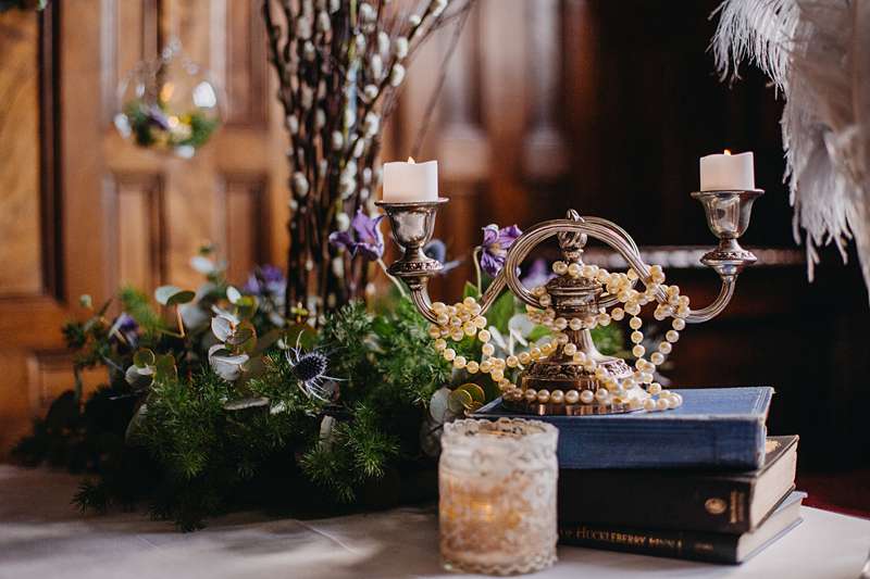 table centre decor pearls and candlestick