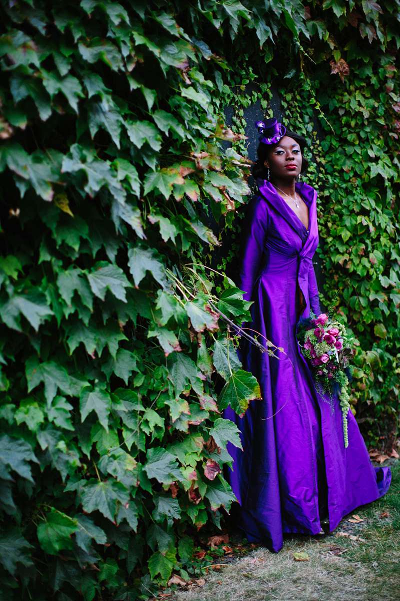 purple alt wedding dress with bouquet and top hat