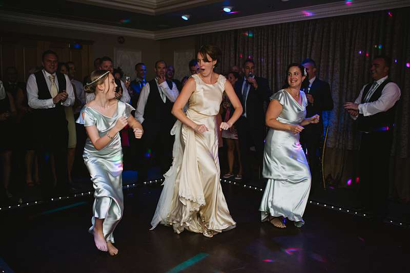 bride and bridesmaids dancing train hookup