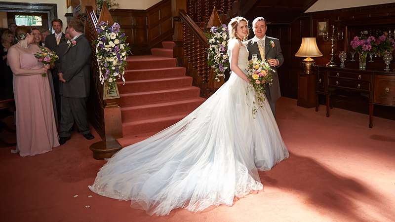 hotel wedding staircase ivory and blue bespoke wedding dress