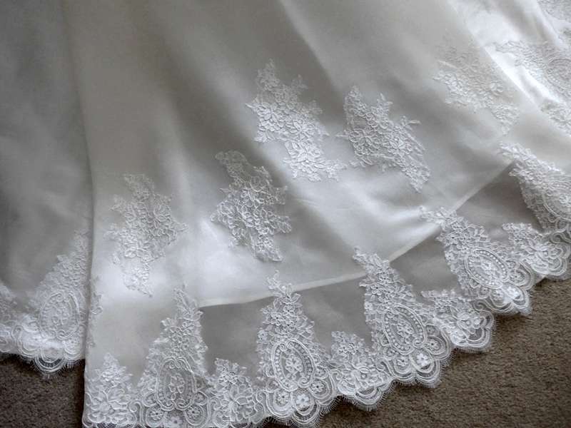 lace applique detail on hand made wedding dress