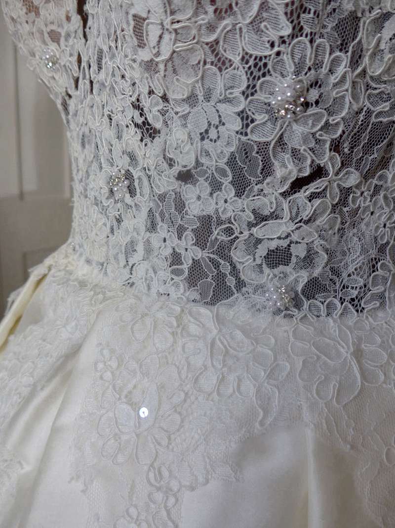 Ivory silk and lace illusion bodice wedding dress finished on the stand
