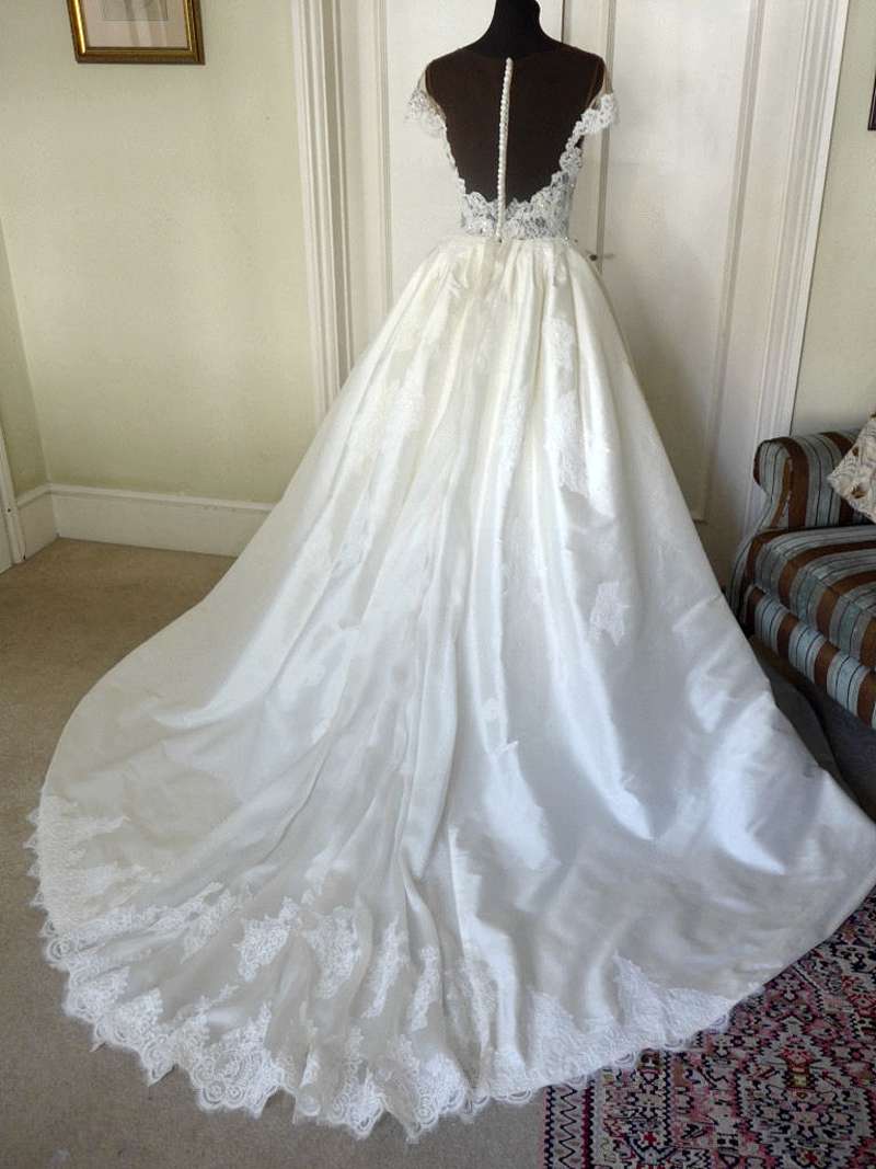 ivory silk wedding dress cathedral train with lace applique
