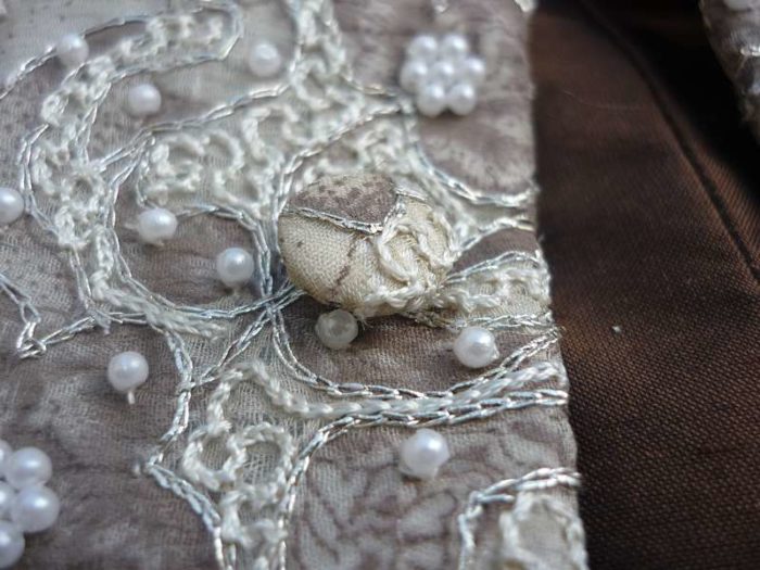 waistcoat cover button detail with pearl and embroidery