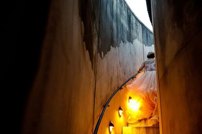 lantern lit bride on the stairs