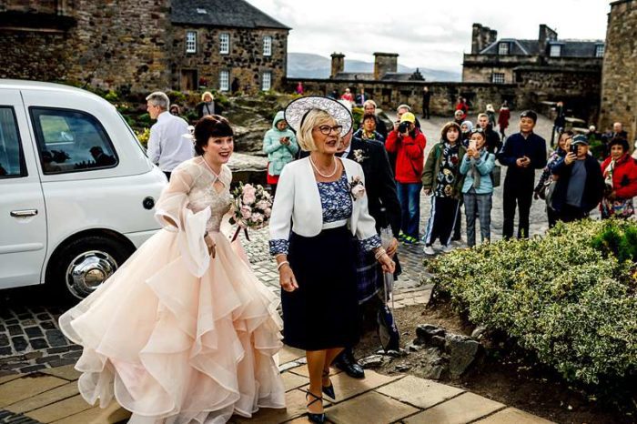 bride arrives theatrical wedding dress