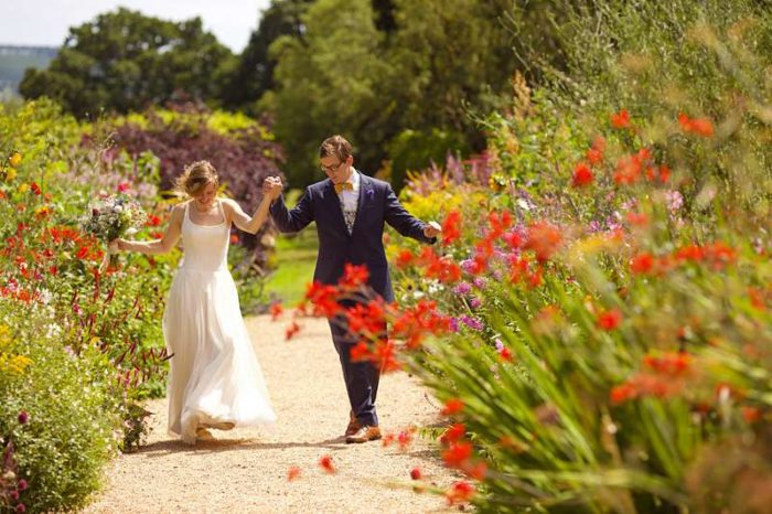 happy vegan bride and groom in summer garden wedding