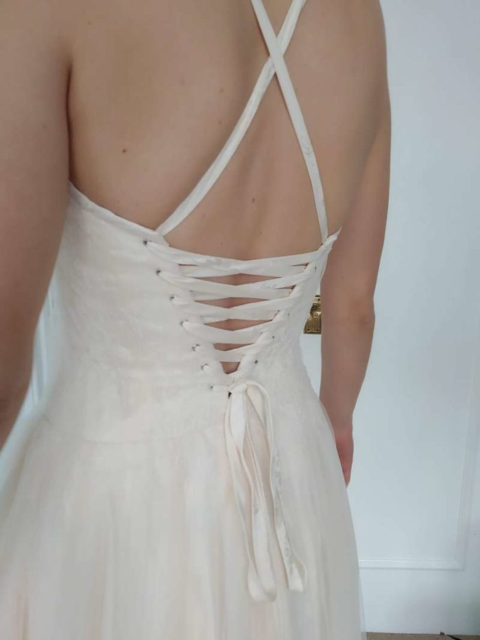 ivory and blush cross over back straps wedding dress