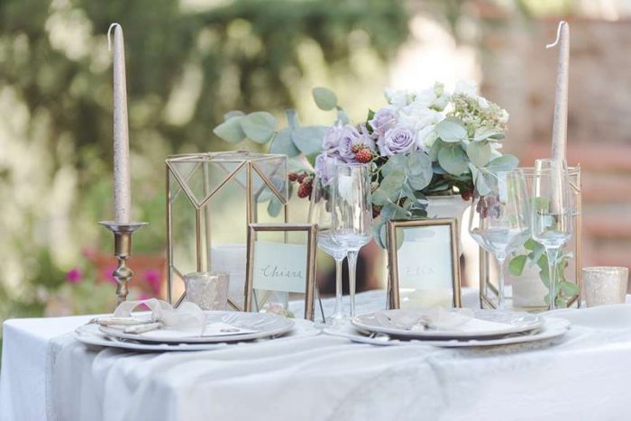 gold candles and vintage lanterns tablescape