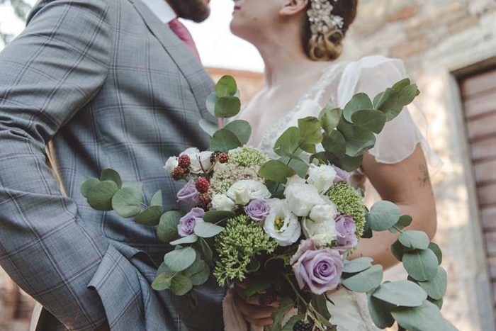 green and lilac bouquet with unripe blackberries