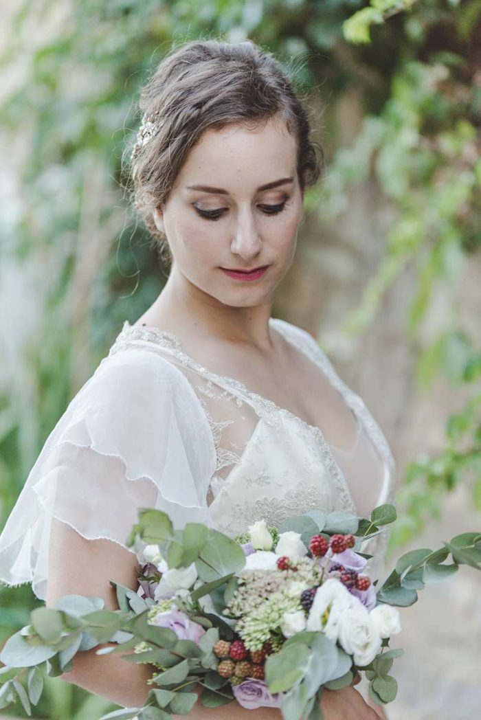 ethereal bride in wedding dress with sleeves