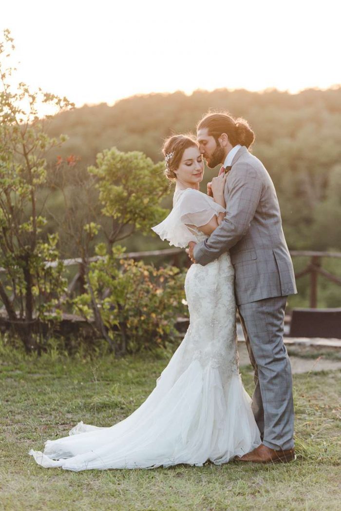 fluted sleeve wedding dress flutters in the wind