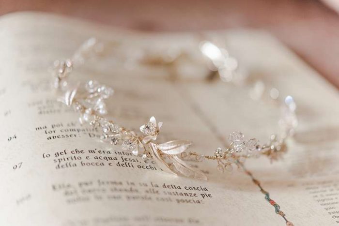 delicate silver hair wreath with leaves on printed page