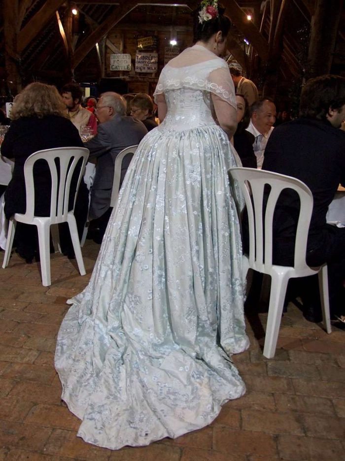 period wedding dress with bum roll back view with train