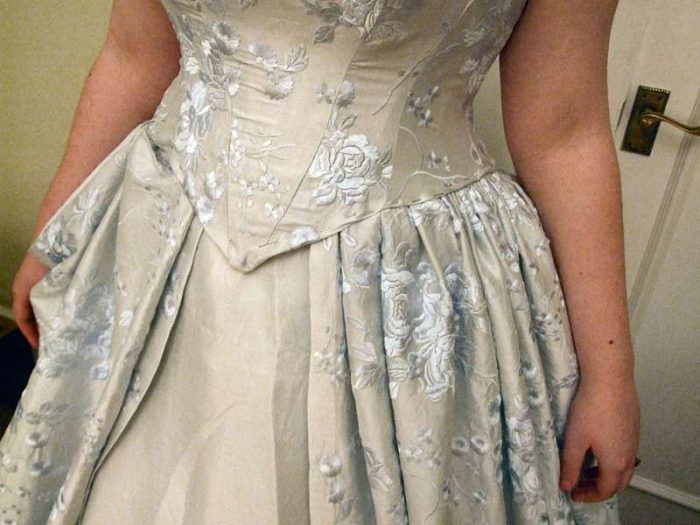 corset waist wedding dress blue silk at fitting
