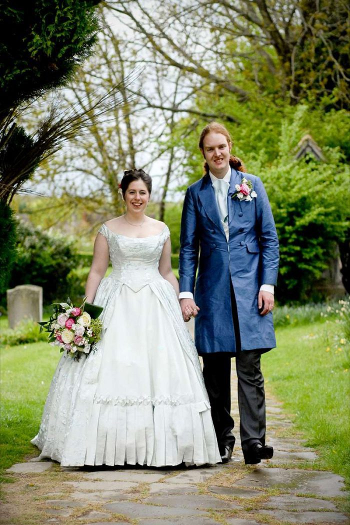 victorian wedding dress for plus size bride in church path
