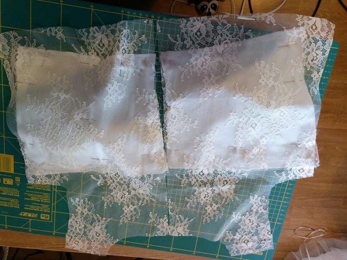 making the dress: back bodice on sewing table with chantilly lace