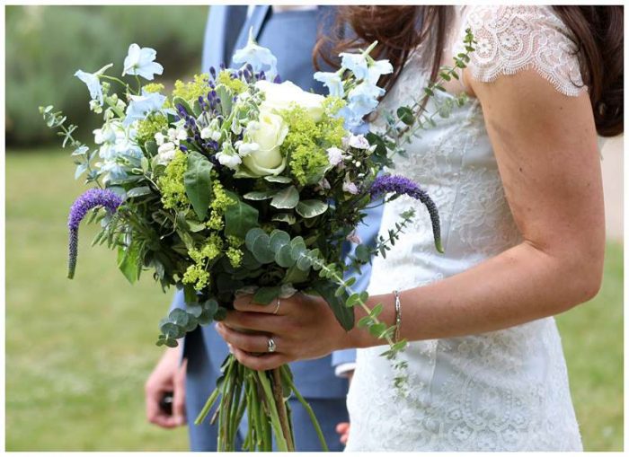 simple wedding dress with lace surrey with bouquet