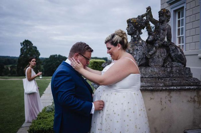 bride in gold star tulle wedding dress with her groom