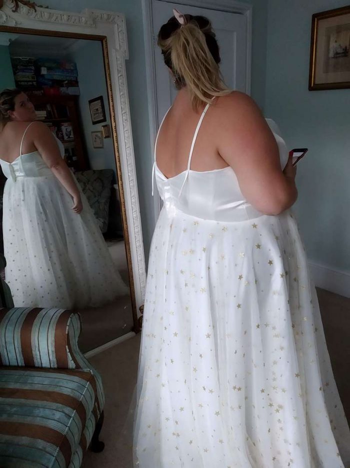 curvy bride fitting with mirror