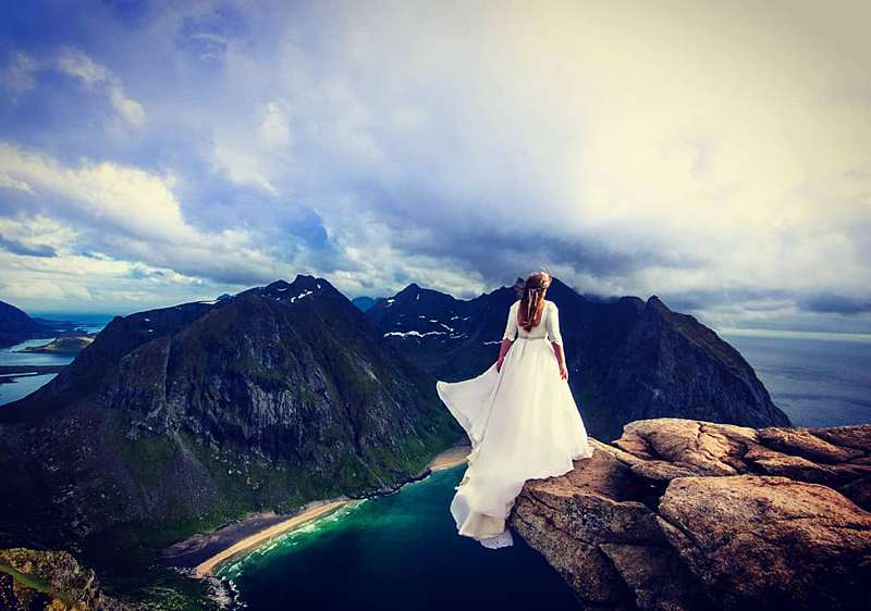 a bespoke wedding dress on a mountain peak