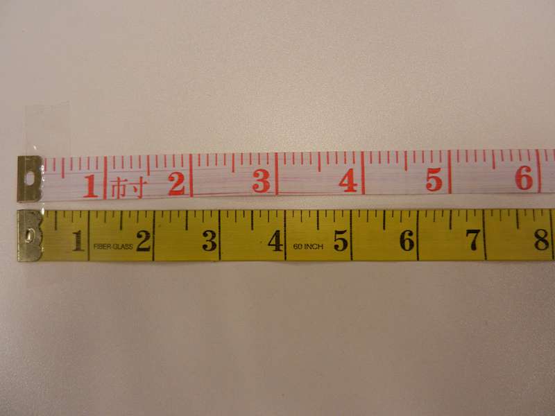 Chinese and imperial inch measuring tapes side by side comparison