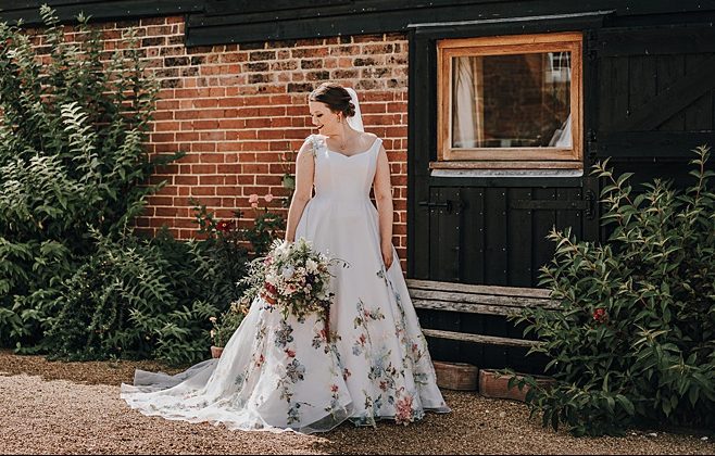 couture wedding dress with painted flowers