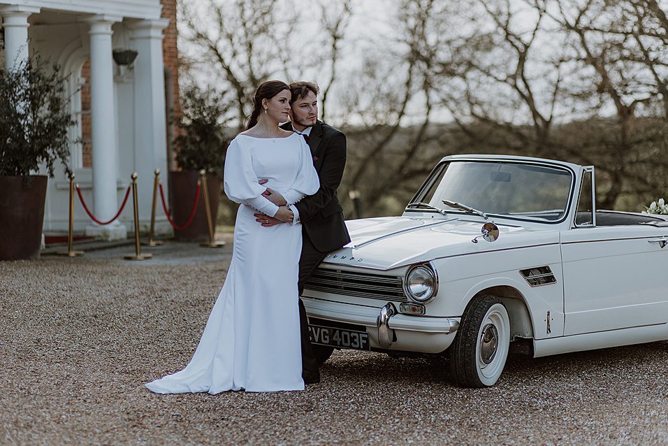 Wedding car for winter wedding with bespoke white wedding dress