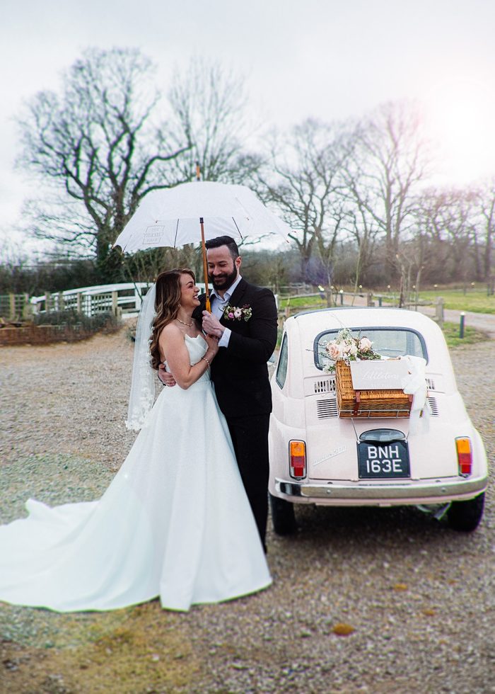 Small wedding car with ivory bespoke wedding dress