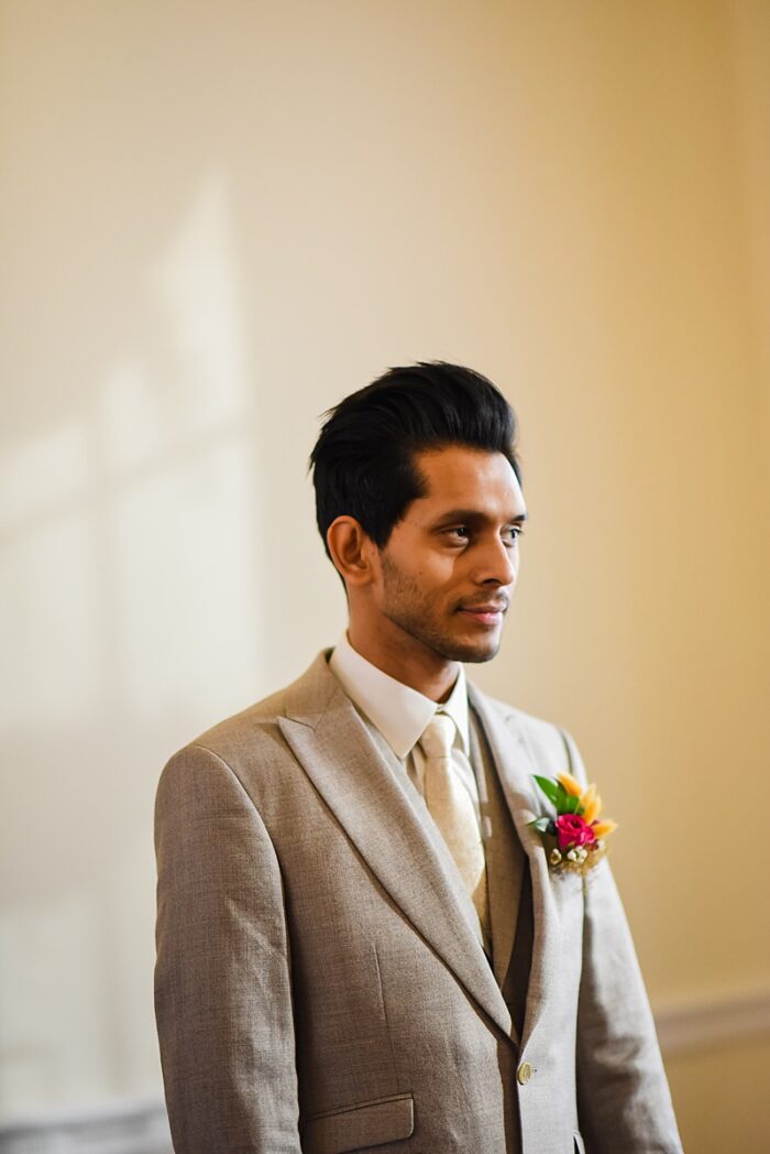 asian groom in lightweight suit