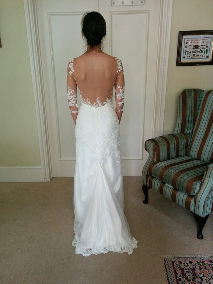 train over-bustle at fitting of custom wedding dress surrey