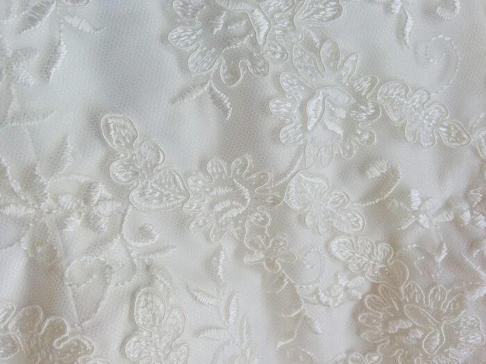 fabric detail of of ivory corded lace