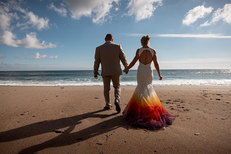 bride groom wedding on beach in cornwall uk boho dip dye wedding dress