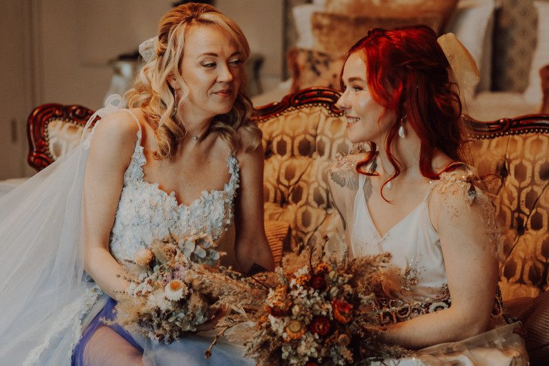 blonde bride dramatic floral wedding dress dried bouquet shoulder bows uk surrey bespoke